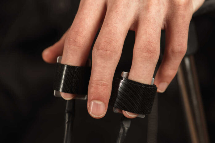Close,Up,,On,Men's,Hands,Wearing,Polygraph,Sensors,,Truth,Detector
