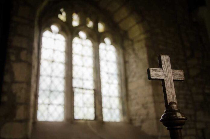 Wooden,Cross,,Symbol,Of,Christian,Faith,,Inside,A,Sacred,Church