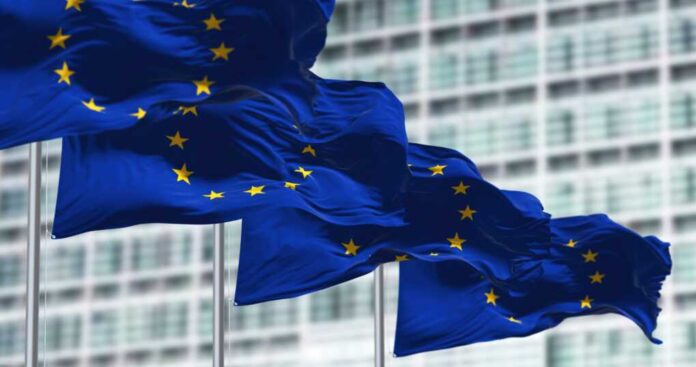 Group,Of,Flags,Of,The,European,Union,Waving,In,The