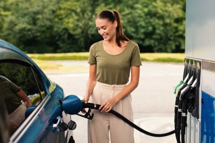 Smiling,Woman,Refilling,Auto,With,Bio,Fuel,At,Modern,Petrol