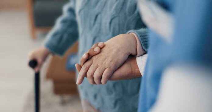 Holding,Hands,,Help,With,Elderly,Person,And,Caregiver,In,Nursing