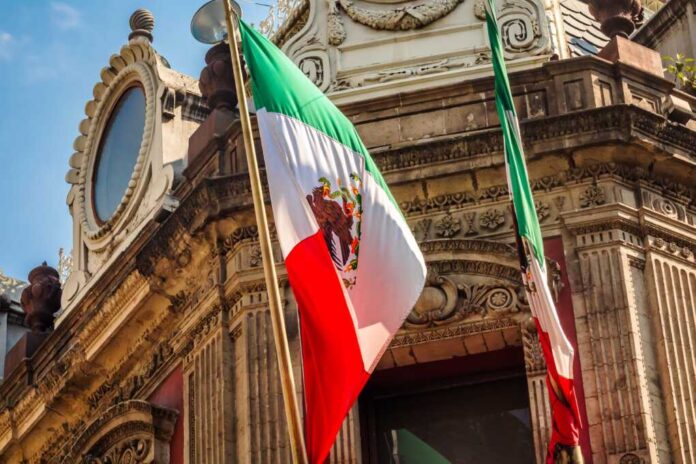Mexican,Flag,On,Building,In,Mexico,City
