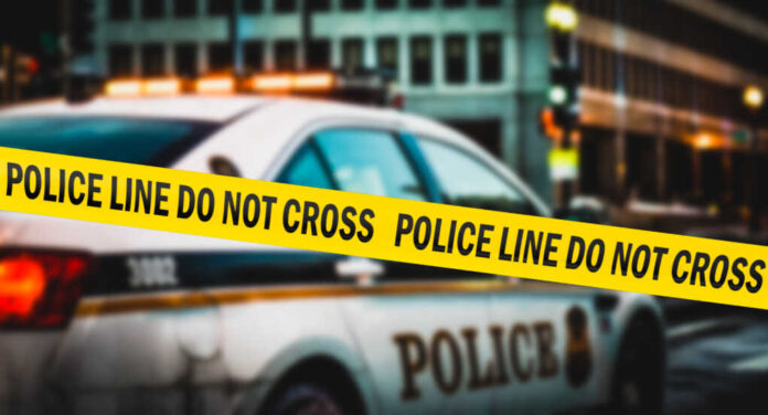 American,Police,Tape,Hangs,Near,A,Police,Car