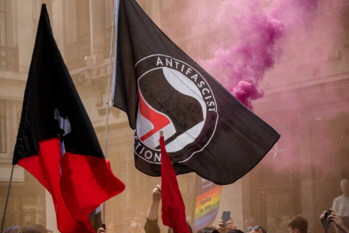The,Antifa,Flag,Being,Displayed,At,An,Anti,Fascist,Demonstration