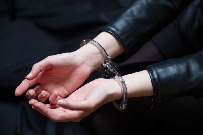 Arrest,,Handcuffed,Criminal,Woman,Hands,Close,Up.,Hand,Cuffs,Locked