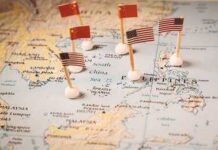 Map of the South China Sea with flags of China and the United States