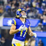 Football player in a blue and yellow uniform celebrating during a game