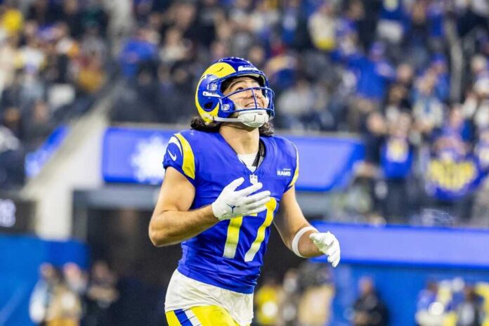 Football player in a blue and yellow uniform celebrating during a game