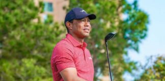 A golfer preparing to swing with a golf club in hand