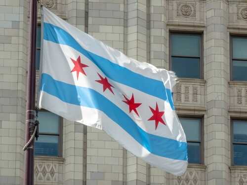 Chicago flag waving in front of a building