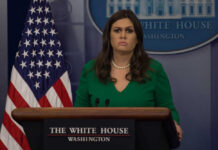 Governor OUSTED From Liberal Diner A government official at a press briefing in front of the American flag