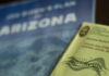 Election materials including a ballot envelope and a campaign brochure for Arizona