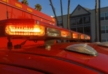 Close-up of emergency vehicle lights on a red ambulance