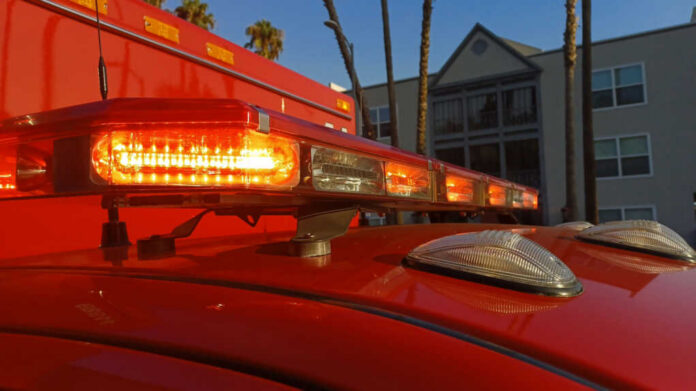 shutterstock2358208403jpg Close-up of emergency vehicle lights on a red ambulance