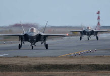 US Dominance Over F-35 Raises Security Alarms Two F-35 fighter jets taxiing on an airfield