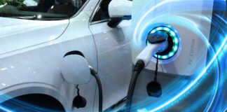Electric vehicle charging at a station with glowing indicators