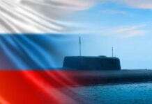 Pentagon Alarmed: Russian Space Nuke Advances A submarine partially submerged in water with the Russian flag in the background