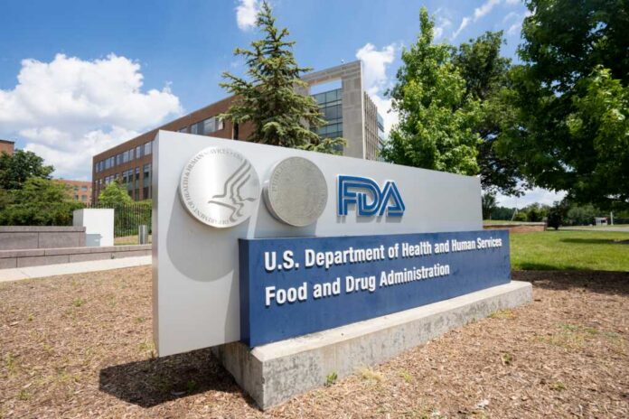 Sign for the U.S. Department of Health and Human Services Food and Drug Administration outside a building