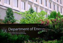 Sign for the Department of Energy surrounded by greenery
