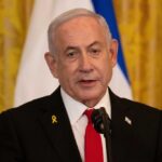 A political leader speaking at a press conference