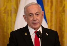 A political leader speaking at a press conference