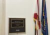 Plaque displaying the name of Representative Sheila Cherfilus-McCormick in a government office