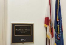 Plaque displaying the name of Representative Sheila Cherfilus-McCormick in a government office