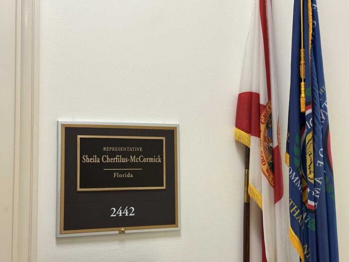 Plaque displaying the name of Representative Sheila Cherfilus-McCormick in a government office