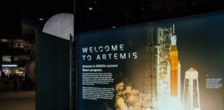 Exhibition display welcoming visitors to the Artemis program with a rocket image