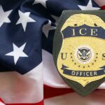 Ninth Circuit Hands Trump Portland Win ICE officer badge displayed on an American flag background