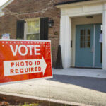 Voter ID Steamrolls California — Democrats Blindsided A sign indicating that photo ID is required to vote at a polling location