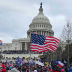 Black Athletes Urged to Boycott – Major Backlash! Crowd of protesters with American flags in front of the Capitol building