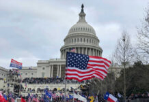 Black Athletes Urged to Boycott – Major Backlash! Crowd of protesters with American flags in front of the Capitol building