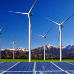 Wind turbines and solar panels in a scenic landscape