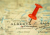 Red pushpin marking Alberta on a map