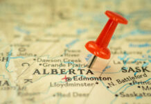 Red pushpin marking Alberta on a map