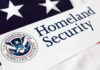 Close-up of the U.S. Department of Homeland Security logo on a flag background