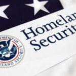 Close-up of the U.S. Department of Homeland Security logo on a flag background