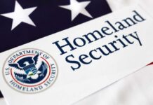 Close-up of the U.S. Department of Homeland Security logo on a flag background