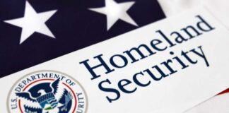 Close-up of the U.S. Department of Homeland Security logo on a flag background