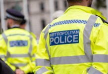 Wrongful Arrests SOAR from Tech Misuse – Unbelievable! Uniformed Metropolitan Police officers standing in a public area