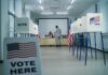 Trump’s Election ‘Army’ Sparks Federal Overreach Fears Interior of a polling station with voting booths and officials