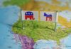 Flags representing the Republican and Democratic parties on a map of the USA