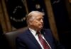 Foreign Tech Giant’s $50M Library Gift Raises Eyebrows A political figure seated with a serious expression in a formal setting
