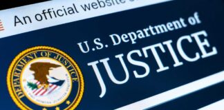 Close-up of the U.S. Department of Justice logo on a website