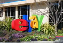 Colorful eBay logo displayed in front of a corporate building