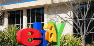 Colorful eBay logo displayed in front of a corporate building