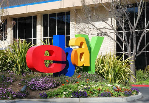 Colorful eBay logo displayed in front of a corporate building