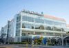 AG Power Play Hits Children’s Hospital Cleveland Clinic building exterior with entrance and parked white van