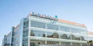 Cleveland Clinic building exterior with entrance and parked white van